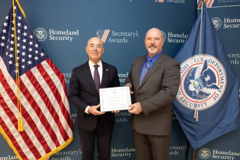 DHS Secretary Alejandro Mayorkas with Innovation Award recipient Robert Paulette.