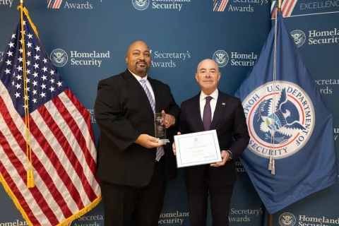 Champion of Equity Award recipient, Curtis Atkinson, with DHS Secretary Alejandro Mayorkas.