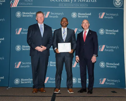 Left to right: U.S. Secret Service Director James Murray, Team Excellence Award recipient Antoine Smith, and DHS Secretary Alejandro Mayorkas.