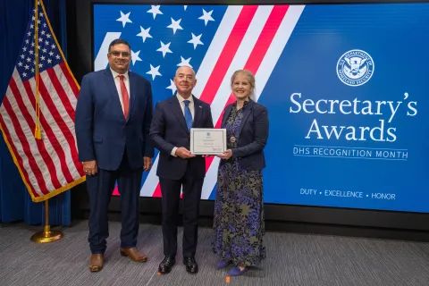 Left to Right: CISA Deputy Director Nitin Natarajan, DHS Secretary Alejandro Mayorkas, and  Innovation Award recipient, Patricia Soler.