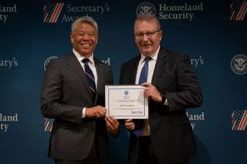 DHS Deputy Secretary John Tien with Team Excellence Award recipient, Timothy Flanagan.