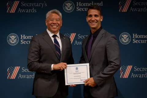 DHS Deputy Secretary John Tien with Innovation Award recipient, Kyle Van Hecke.