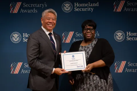 DHS Deputy Secretary John Tien with Team Excellence Award recipient, Sharon Deshield.