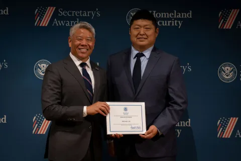 DHS Deputy Secretary John Tien with Innovation Award recipient, Michael Lee.