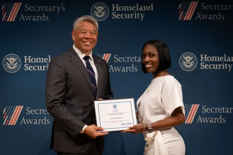 DHS Deputy Secretary John Tien with Team Excellence Award recipient, Latasha Kennedy.