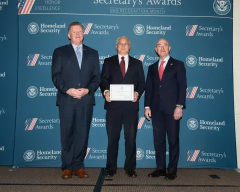 Left to right: U.S. Secret Service Director James Murray, Team Excellence Award recipient Kenneth Lee, and DHS Secretary Alejandro Mayorkas.
