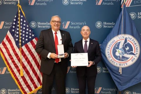 Secretary's Gold Medal recipient, Friend L. Walker, with DHS Secretary Alejandro Mayorkas