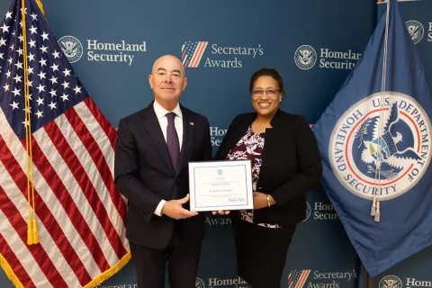 DHS Secretary Alejandro Mayorkas with Innovation Award recipient Acenitha L. Kennedy.