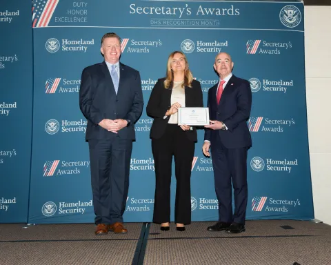 Left to right: U.S. Secret Service Director James Murray, Innovation Award recipient Jessica Nemet, and DHS Secretary Alejandro Mayorkas.