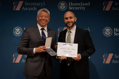 DHS Deputy Secretary John Tien with Secretary's Silver Medal recipient, Ahmad Gharib.