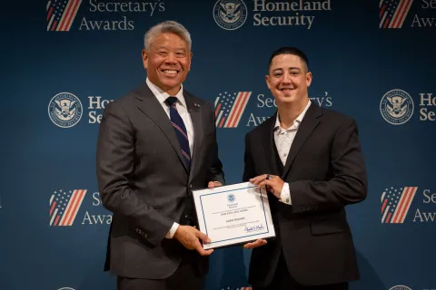 DHS Deputy Secretary John Tien with Team Excellence Award recipient, Adam Passaro.