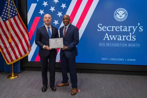 DHS Secretary Alejandro Mayorkas with Innovation Award recipient, Mohamed I. Bah.