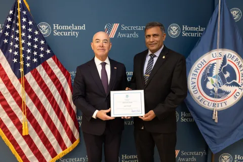 DHS Secretary Alejandro Mayorkas with Innovation Award recipient Ajay Phogat.