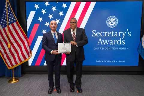 DHS Secretary Alejandro Mayorkas with Innovation Award recipient, Darryl Wilkerson.