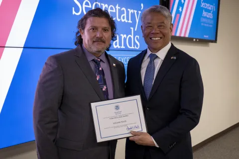 Team Excellence Award recipient, William Fidler, with DHS Deputy Secretary John Tien. 