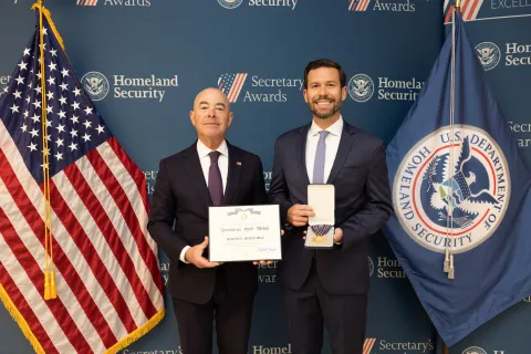 DHS Secretary Alejandro Mayorkas with Secretary's Gold Medal recipient, Joseph E. Roeschke.