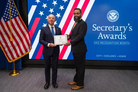 DHS Secretary Alejandro Mayorkas with Innovation Award recipient, Samuel Padilla.