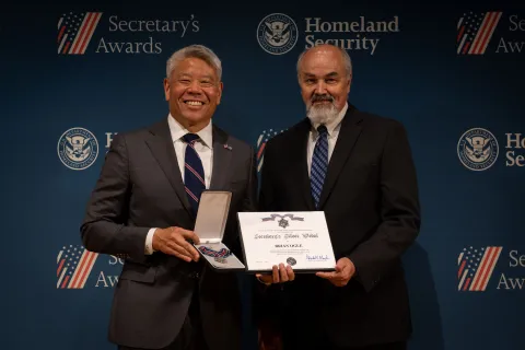 DHS Deputy Secretary John Tien with Secretary's Silver Medal recipient, Brian Ogle.