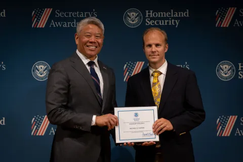 DHS Deputy Secretary John Tien with Leadership Excellence Award recipient, Michael D. Huston.