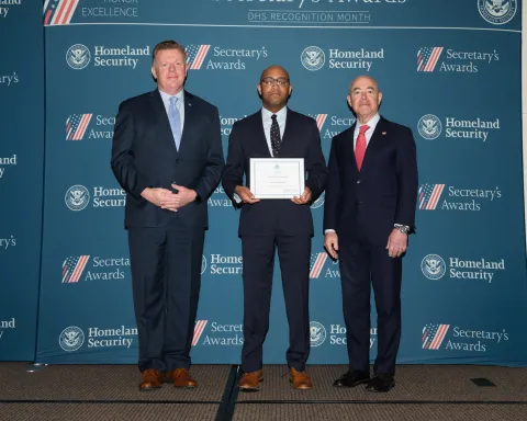 Left to right: U.S. Secret Service Director James Murray, Team Excellence Award recipient Derek Lawhorn, and DHS Secretary Alejandro Mayorkas.