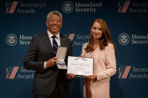 DHS Deputy Secretary John Tien with Secretary's Silver Medal recipient, Amanda Day.