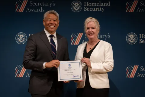 DHS Deputy Secretary John Tien with Champion of Equity Award recipient, Geralyn Ryan.