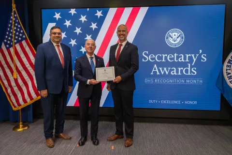 Left to Right: CISA Deputy Director Nitin Natarajan, DHS Secretary Alejandro Mayorkas, and  Innovation Award recipient, Jay Gazlay.