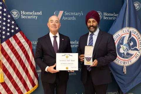 DHS Secretary Alejandro Mayorkas with Secretary's Gold Medal recipient, Manpreet S. Dhanjal.