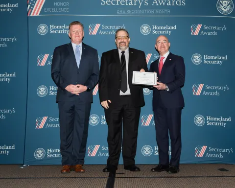 Left to right: U.S. Secret Service Director James Murray, Team Excellence Award recipient William B. Willson, and DHS Secretary Alejandro Mayorkas.