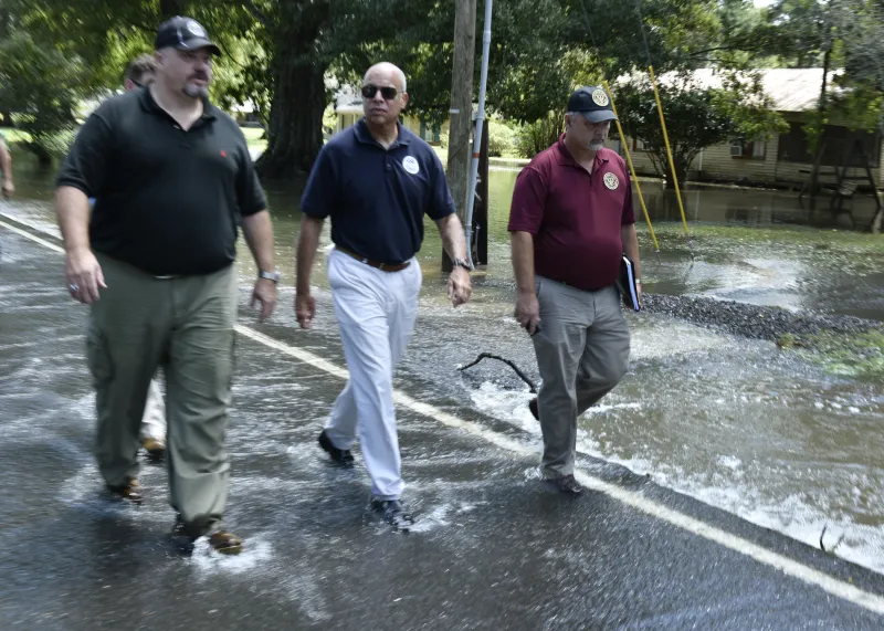 Secretary Johnson walks through flooded streets of Ascension