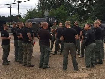 ICE team of agents and officers discuss their plan of action upon arriving in Texas. (Photo courtesy of ICE Public Affairs) 