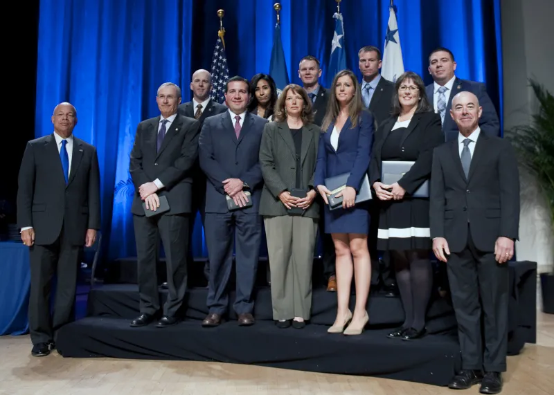 Secretary of Homeland Security Jeh Johnson and Deputy Secretary of Homeland Security Alejandro Mayorkas presented the Secretary's Meritorious Service Medal to the Software Slashers Investigation Team
