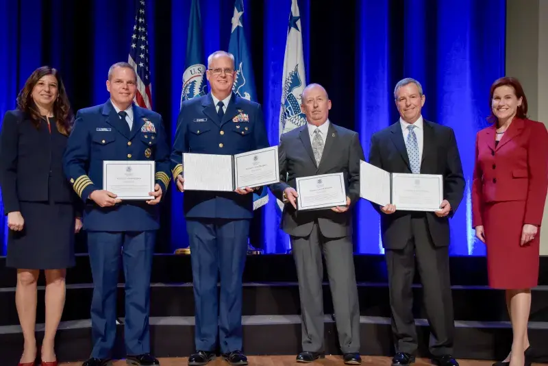 The Eastern Caribbean Regional Integrating Group receive the Secretary's Unity Effort Award at the Department of Homeland Security Secretary's Awards Ceremony in Washington, D.C., Nov. 8, 2017. The group, comprised of Immigration and Customs Enforcement and U.S. Coast Guard, was honored for working together in support of the DHS mission, to gather intelligence, investigate and interdict criminals. Official DHS photo by Jetta Disco.