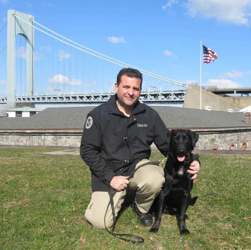 TSA Canine Ssiller and TSA Canine Handler Christopher Neeson pose for a photo in New York