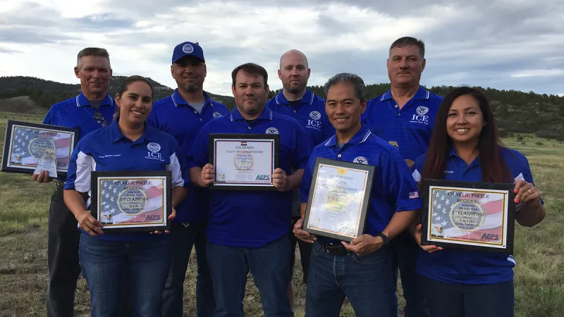 The ICE National Pistol Team poses for a photo with their awards from the Rocky Mountain Nationals competition. (Photo courtesy of ICE)