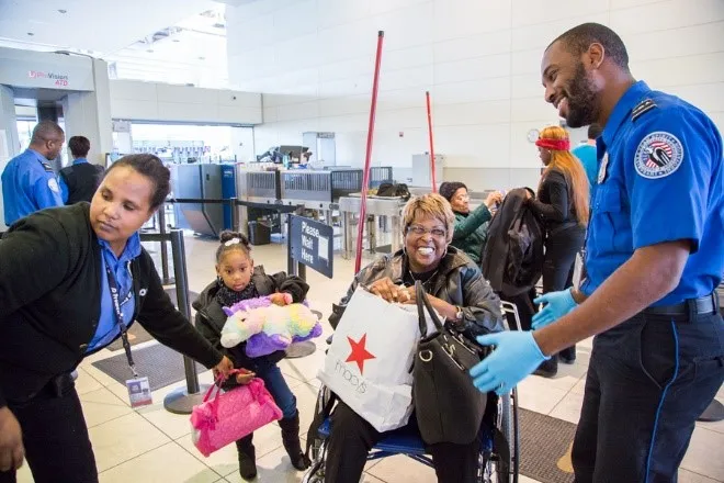 Officers complete passenger screening at Baltimore/Washington International Thurgood Marshall Airport. (Photo provided by TSA Public Affairs)