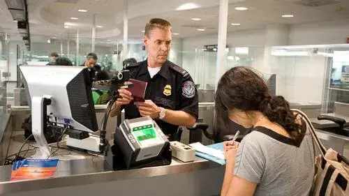 Customs and border protection agent working in airport customs