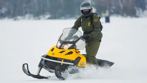 Border protection agent on snowmobile