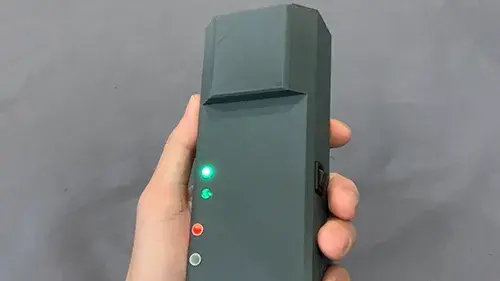 Current prototype of the POINTER receiver, which is worn by responders entering a structure. What is now the size of a cell phone will ultimately be reduced in scale and potentially integrated into existing firefighting equipment.