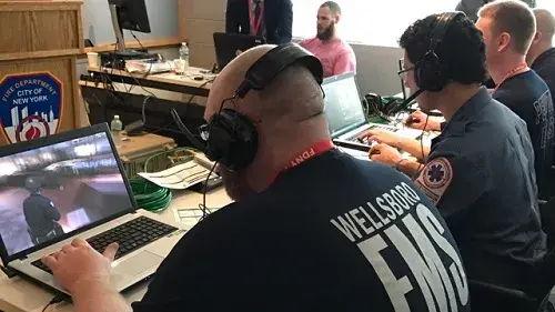Actual first responders at laptops navigating an EDGE scenario at a recent training event in New York City.