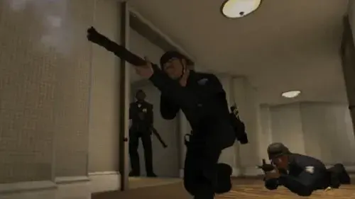 EDGE law enforcement avatars kneel with weapons drawn in a virtual hotel hallway.