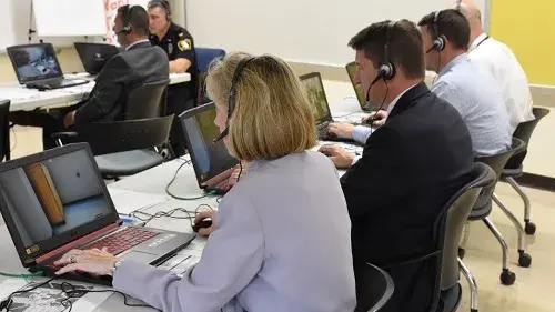 Educators and first responders collaborate on a simulated response scenario during a September 2018 training in West Orange, New Jersey.