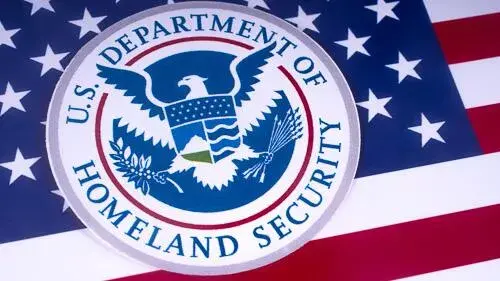 DHS seal overlayed on American flag
