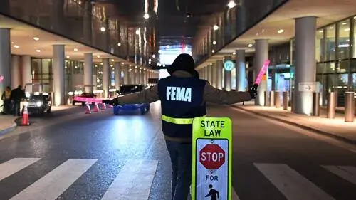 FEMA employee directing traffic
