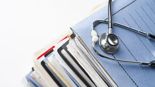 Stethoscope on medical files