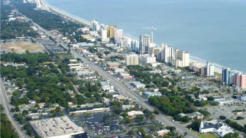 City along the coast with body of water on the side 