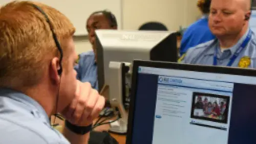 Man sitting at computer taking virtual lessons