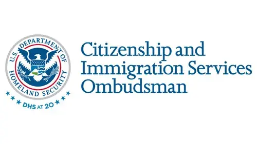 Horizontal CISOMB wordmark/lockup in blue with "DHS at 20" below the DHS seal