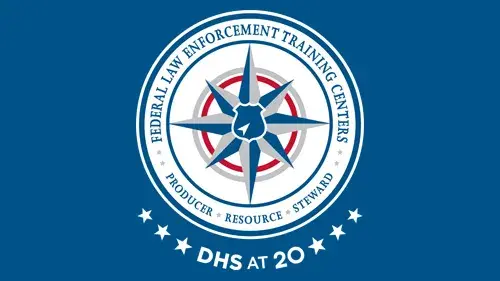 FLETC logo with "DHS at 20" below the FLETC logo in white