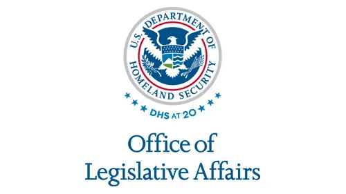Vertical OLA wordmark/lockup in blue with "DHS at 20" below the DHS seal